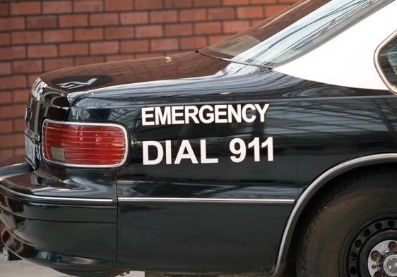 Patrol vehicle with EMERGENCY DIAL 911 lettering