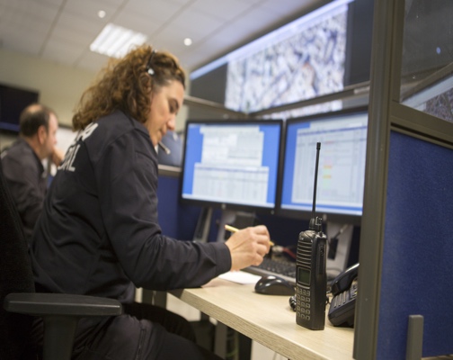Dispatcher working at a multi-screen console